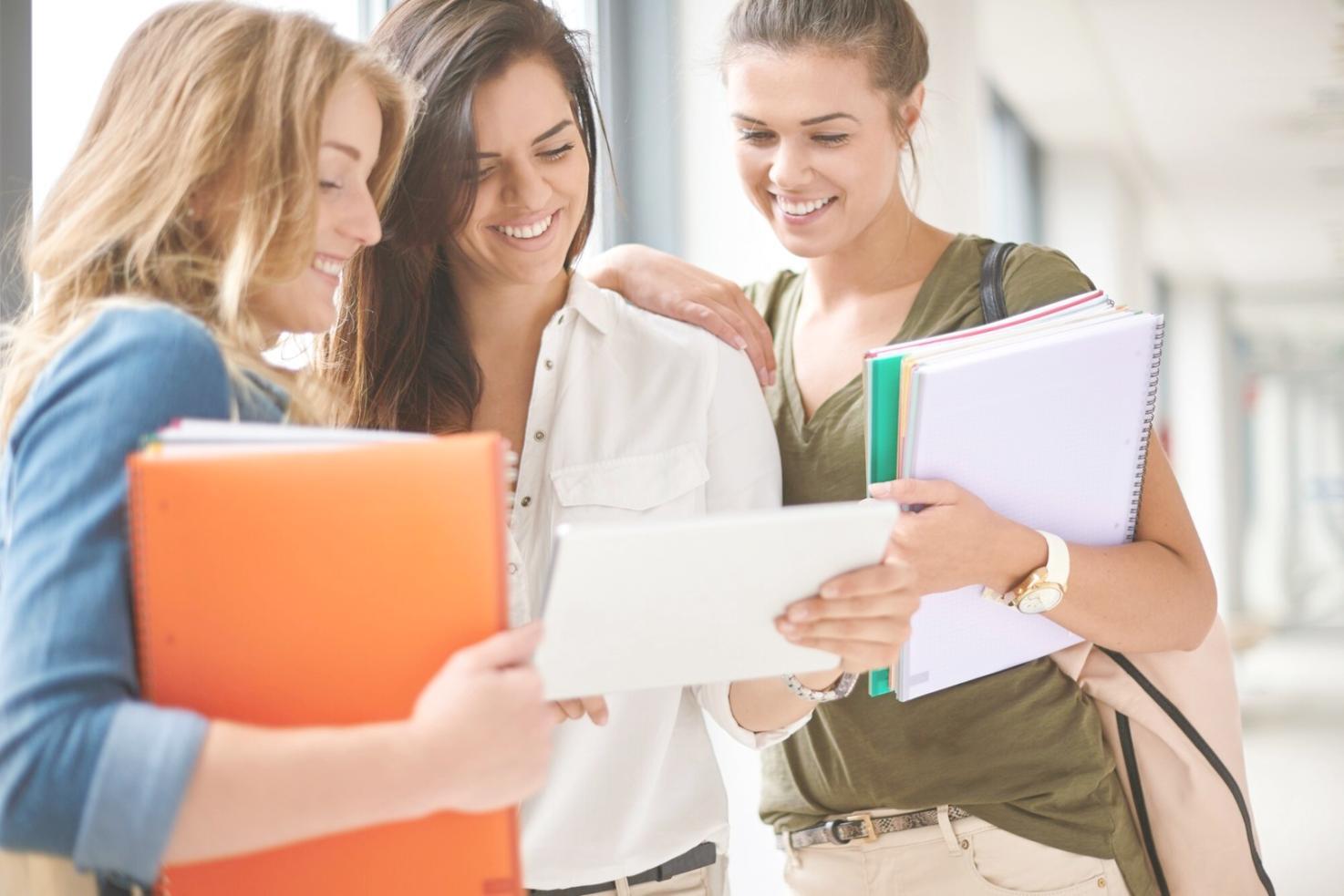 Students working on budget planning project in classroom